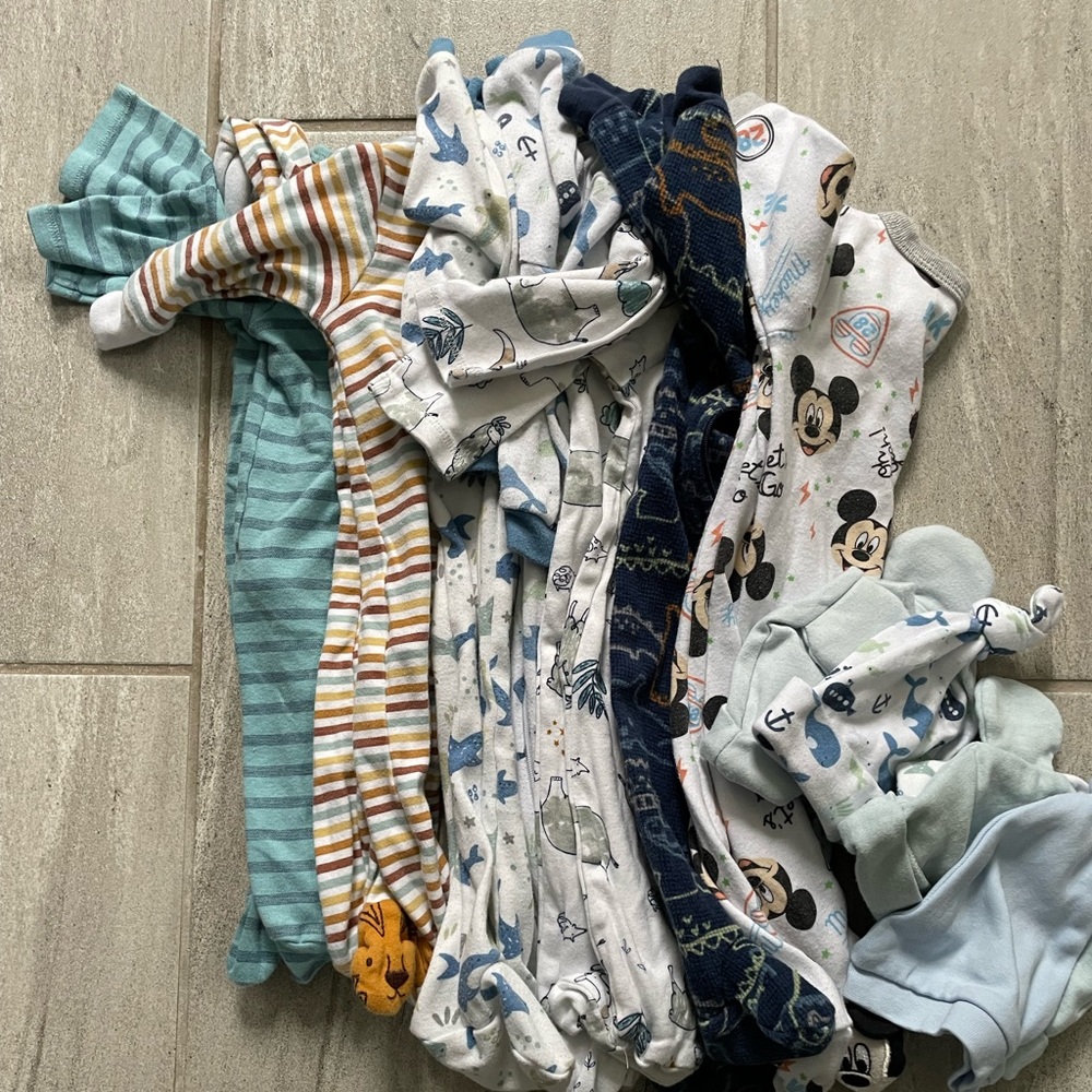 7 pairs of 0/3 and 3 month footie pajamas